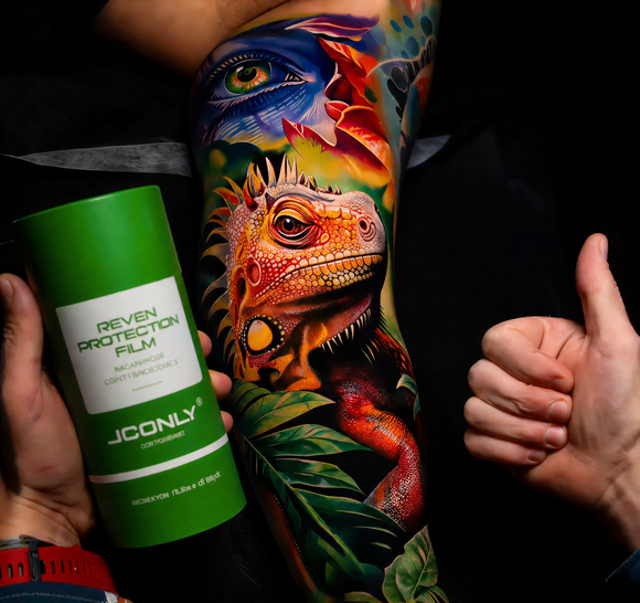 Iguana tattoo by artist @tomashblaszczak, with REVEN tattoo protection film to maintain vibrant colors.